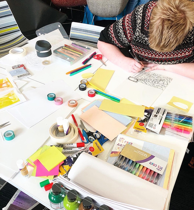 student colouring in