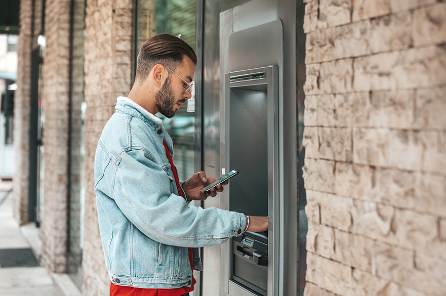 Student at cash machine