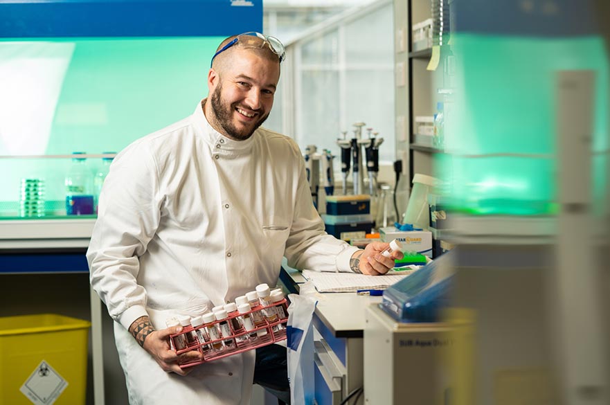 Biosciences PhD student in lab