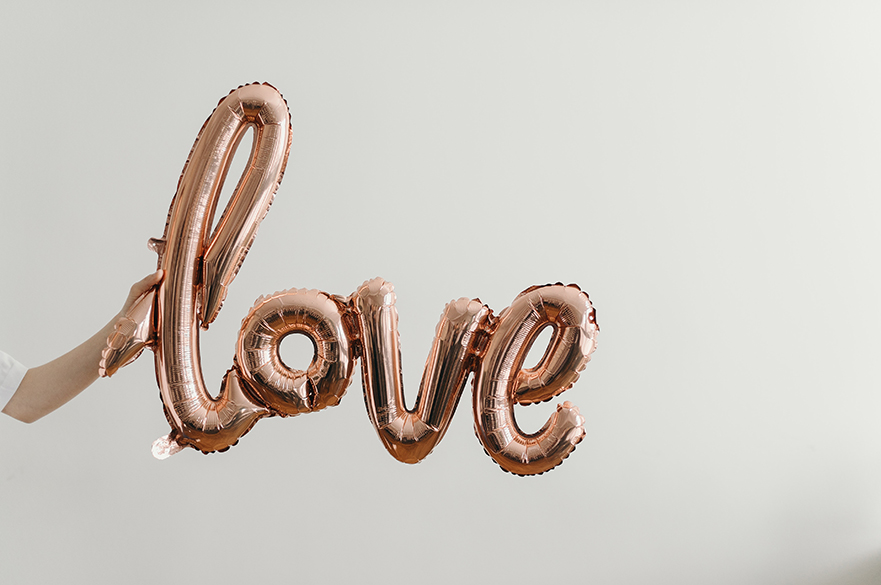 Balloons that spell out the word love.  