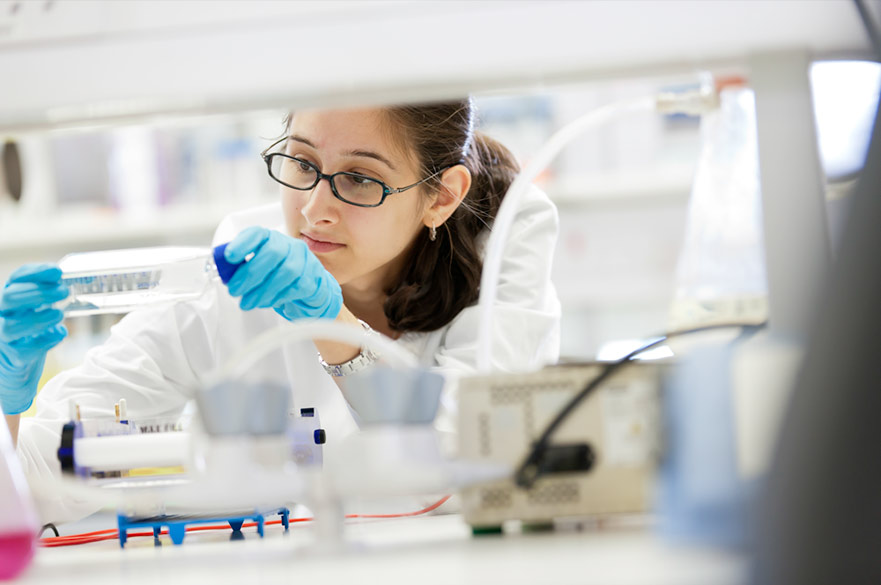 Girl scientific researcher wearing glasses