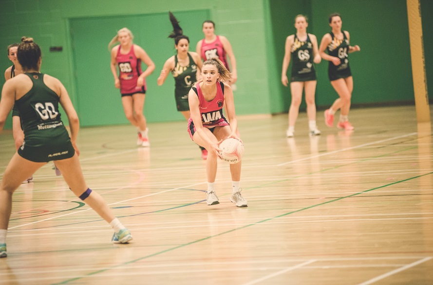 NTU Netball player with the ball in hand