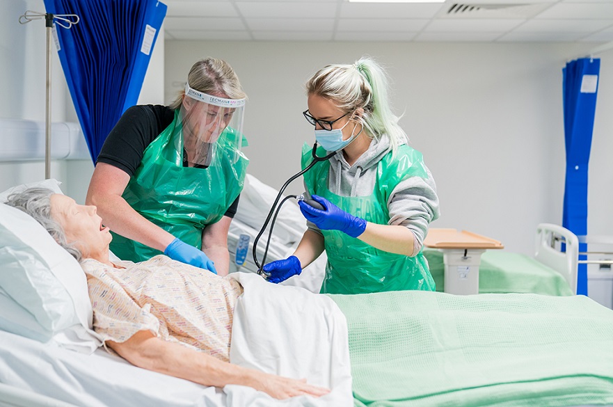 Students working on a patient mannikin