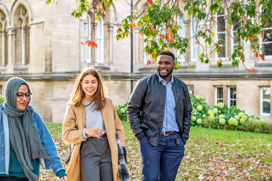 three students walking outside