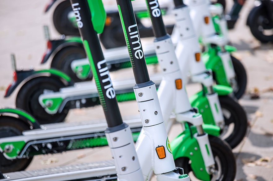 Lime scooters in a row