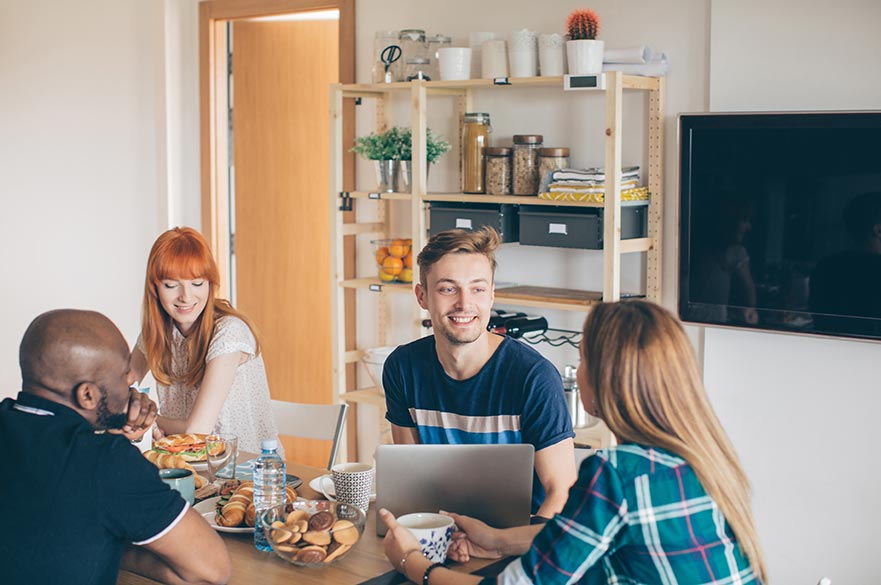 Postgraduate students in kitchen