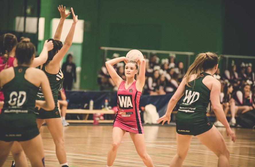 NTU Netball player with the ball in hand