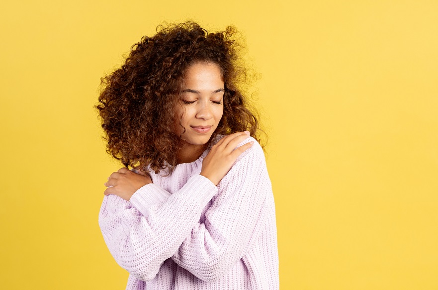 Women giving herself a hug