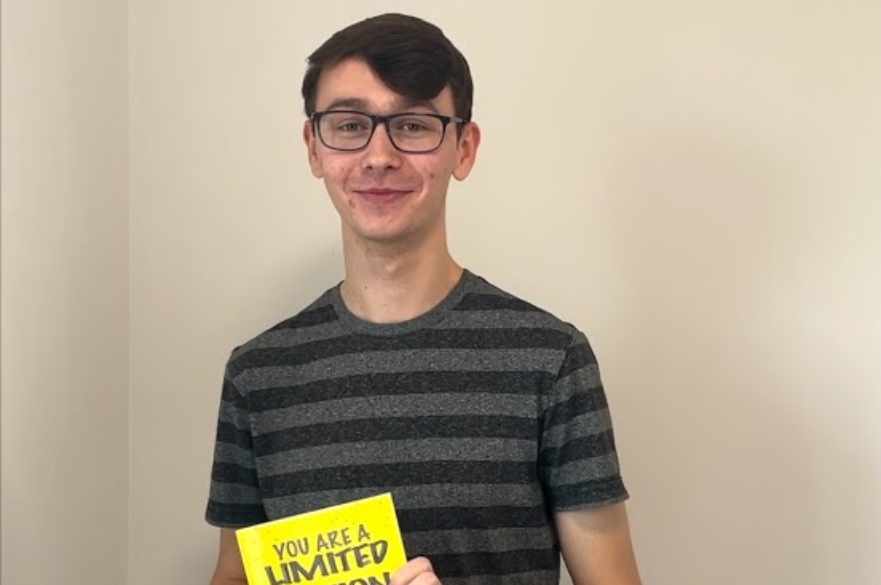 student holding book