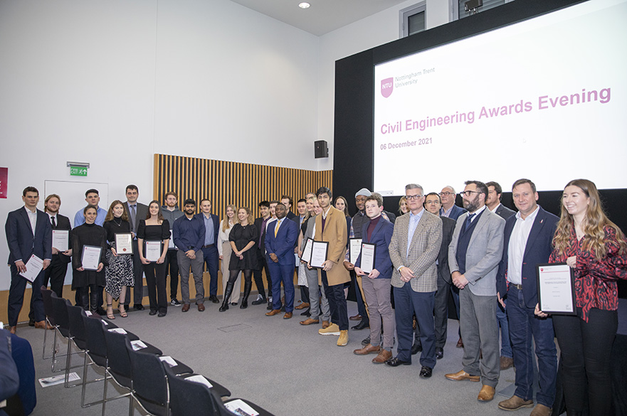 A group of student prize winners with their certificates