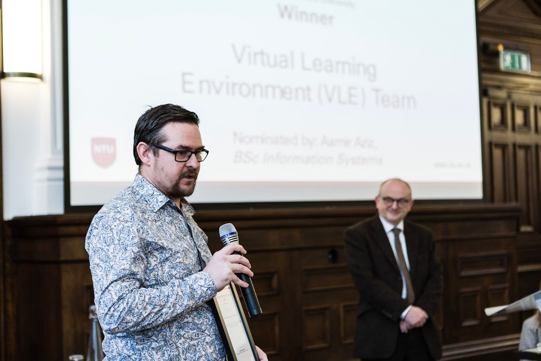 Adam Elce accepting award for NTU Virtual Learning Environment Team