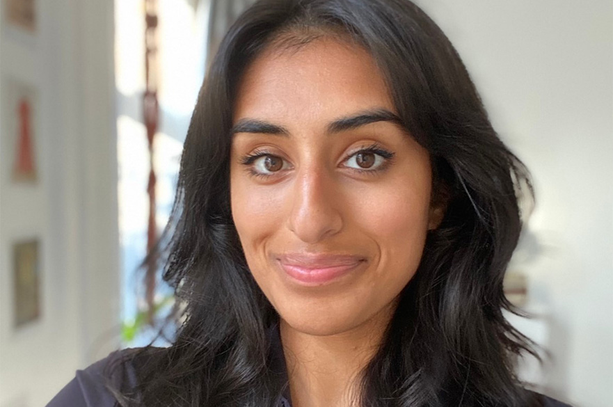 A close up image of a woman smiling.