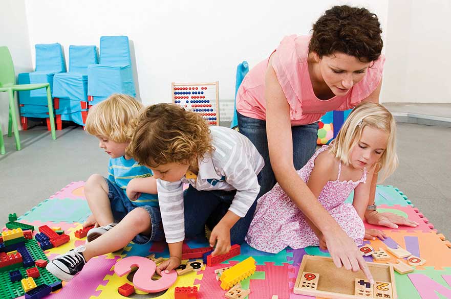 Children playing on mat
