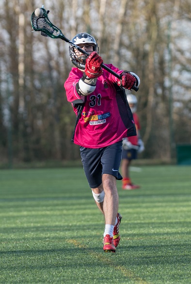Student playing Lacrosse 