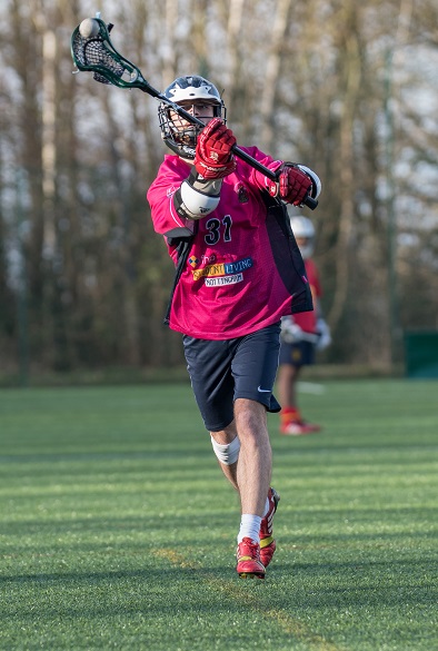 Student playing Lacrosse
