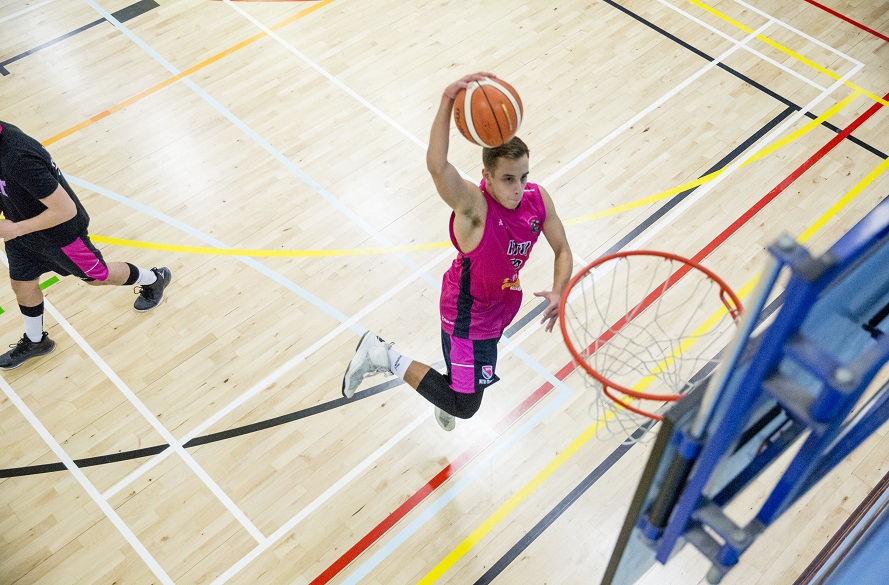 NTU Male Basketball player jumping for a shot