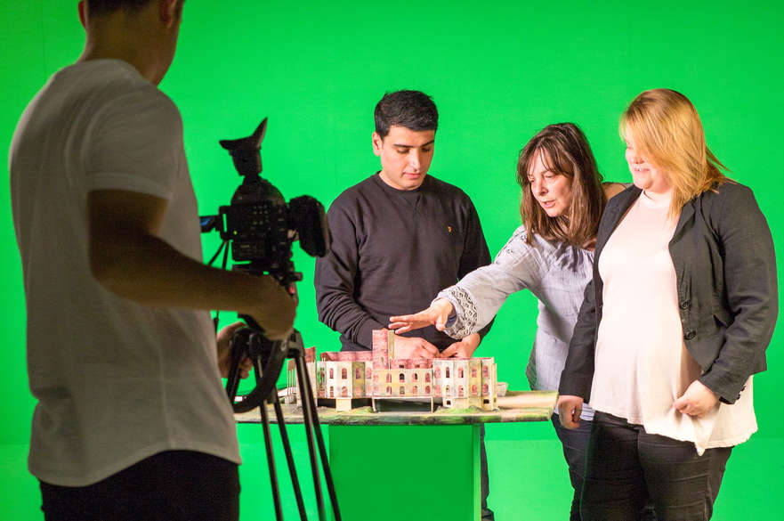 Students working with green screen in the studio