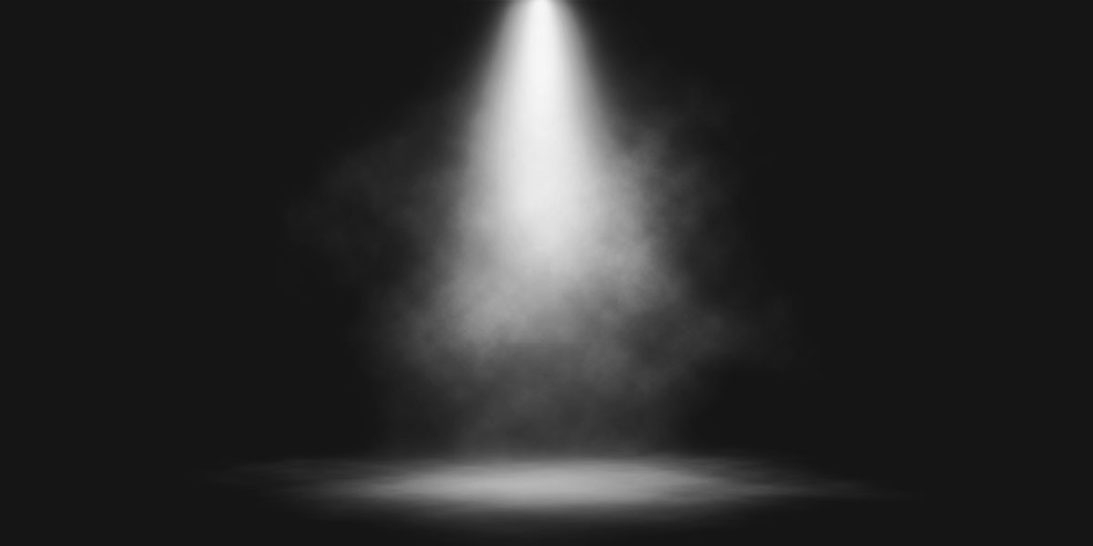 A dark room lit by a spotlight.
