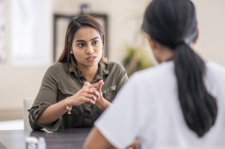 Woman talking to someone in the workplace