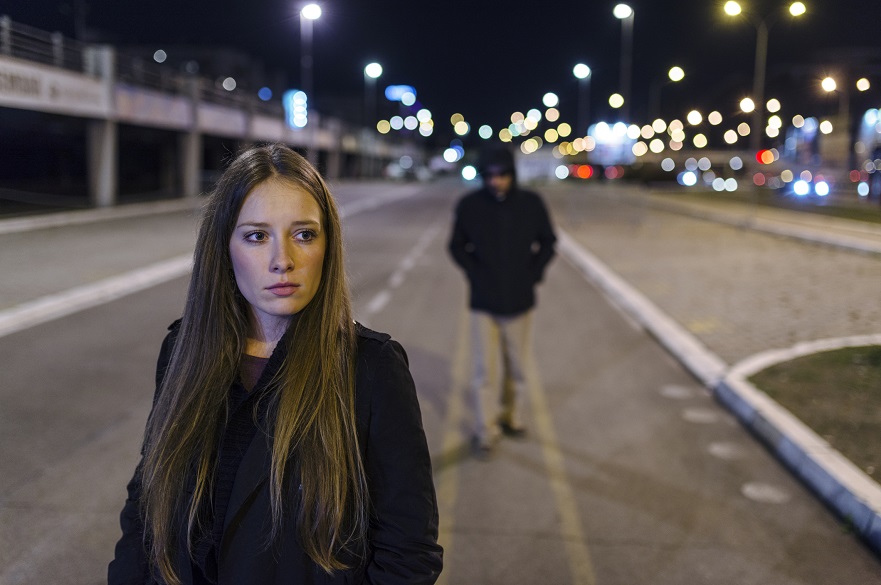 Woman being following on street