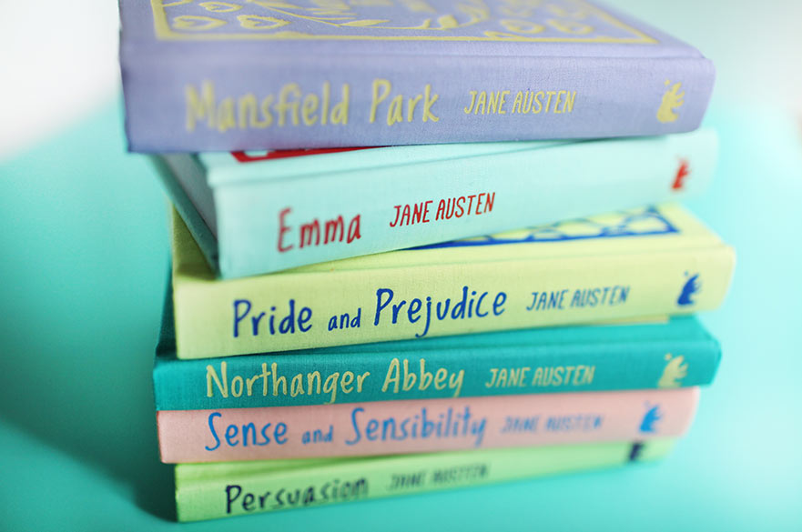 a colourful stack of books written by Jane Austen