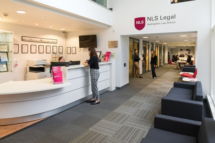 NLS Legal office reception with young lady standing at the desk