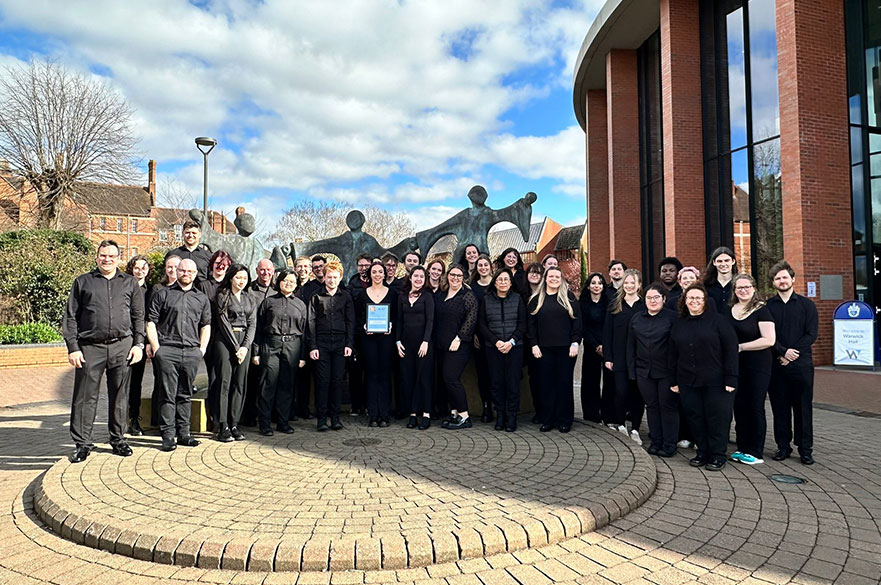 A group shot of the NTU Concert Band with their award outside the National Concert Band Festival