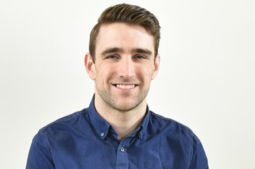 A person smiling at the camera.