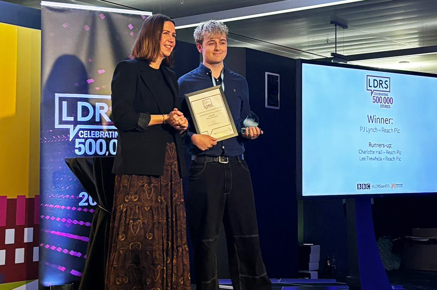 PJ accepting his award on stage