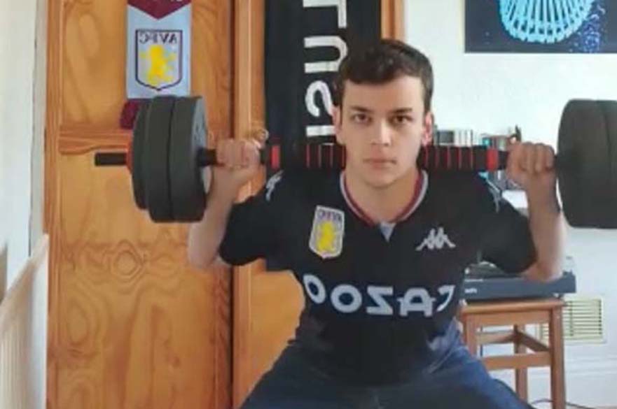 Student lifting weights to raise money for good causes