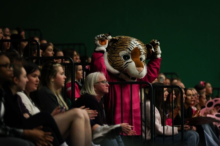 a photo of the trent tiger mascot in the crowd at the netball varsity match