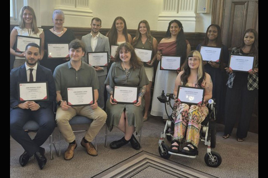 A group of students holding certificates at the Jamie Marshall Awards event