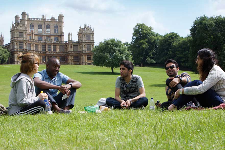 Students sitting in Wollaton Park