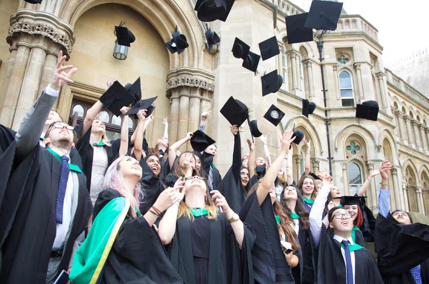 Graduates throwing caps