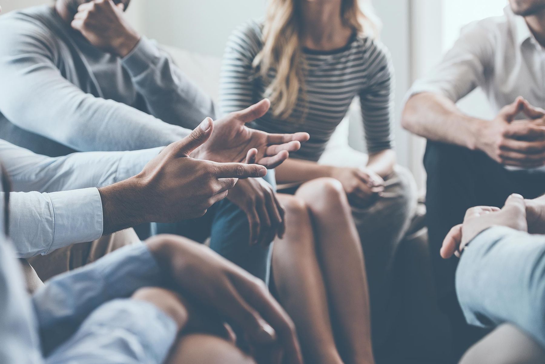 people sat in a circle talking