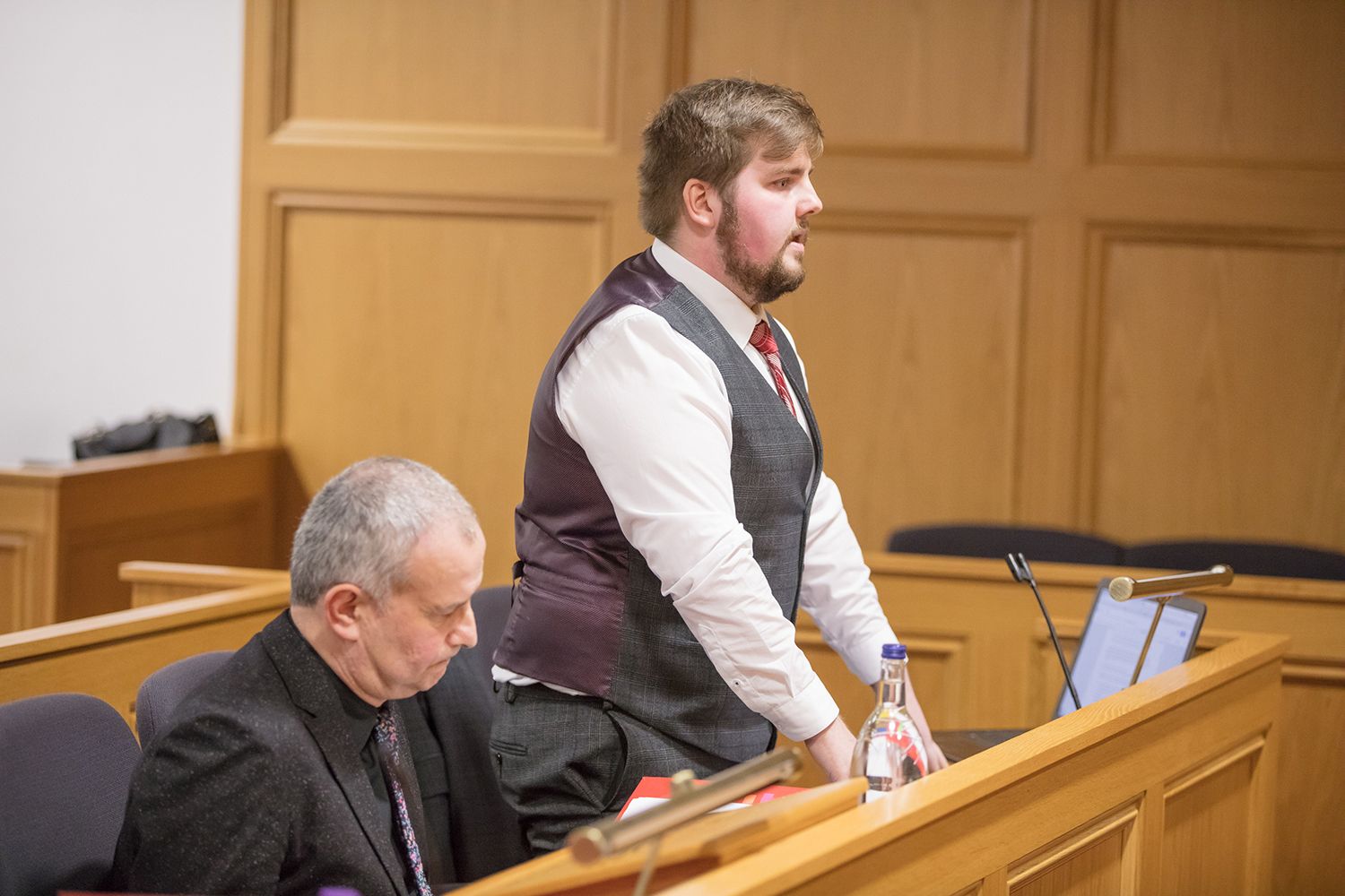 Two men in a courtroom