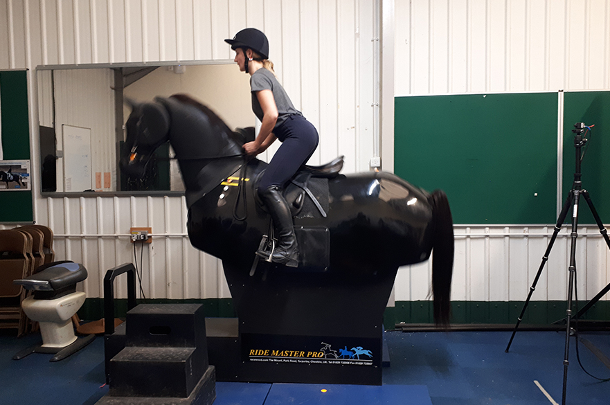 Student using mechanical horse