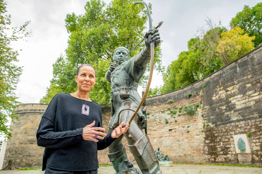 A student with the Robin Hood statue