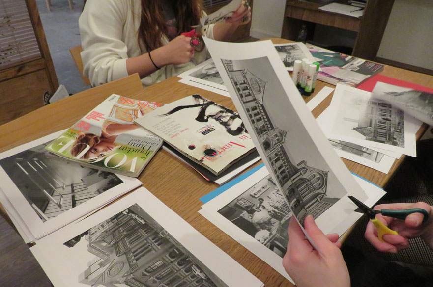 A table with collage materials and people cutting out images.