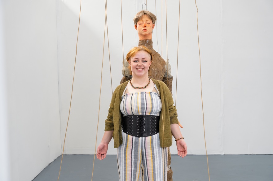 Cerys Sleith with her artwork puppet