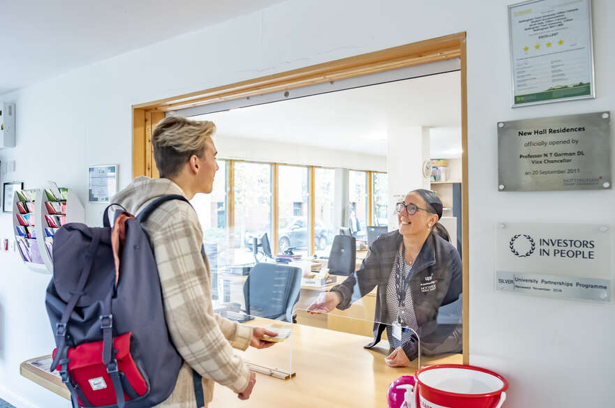 Student speaking to accommodation officer at New Hall residence, Clifton Campus