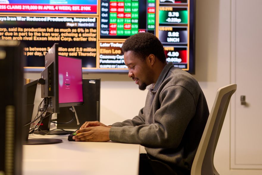 Economics student using computer in the business lab