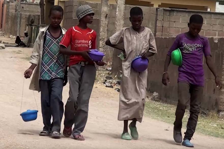 Nigerian children walking down a road