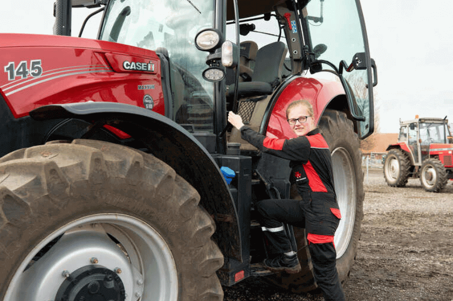 Student using a tractor