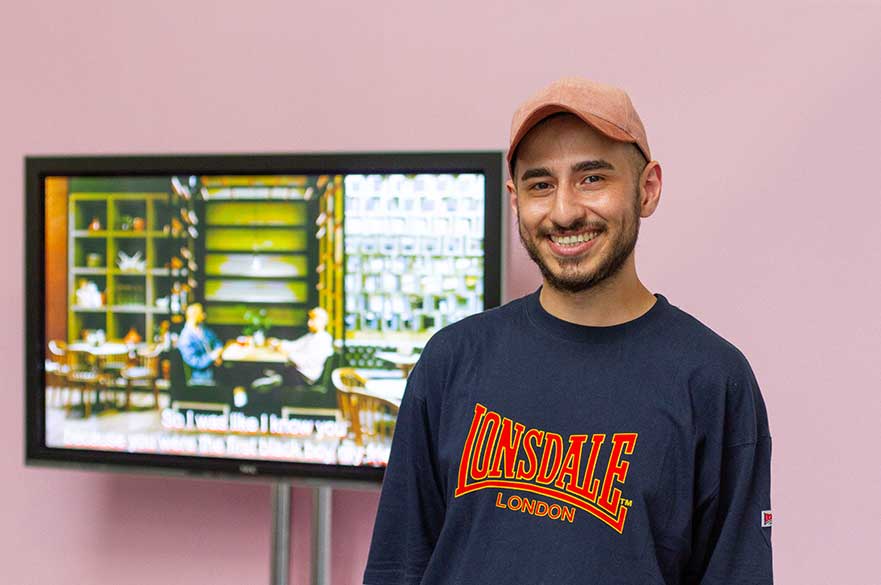 Agil with his work at the 2018 Degree Show