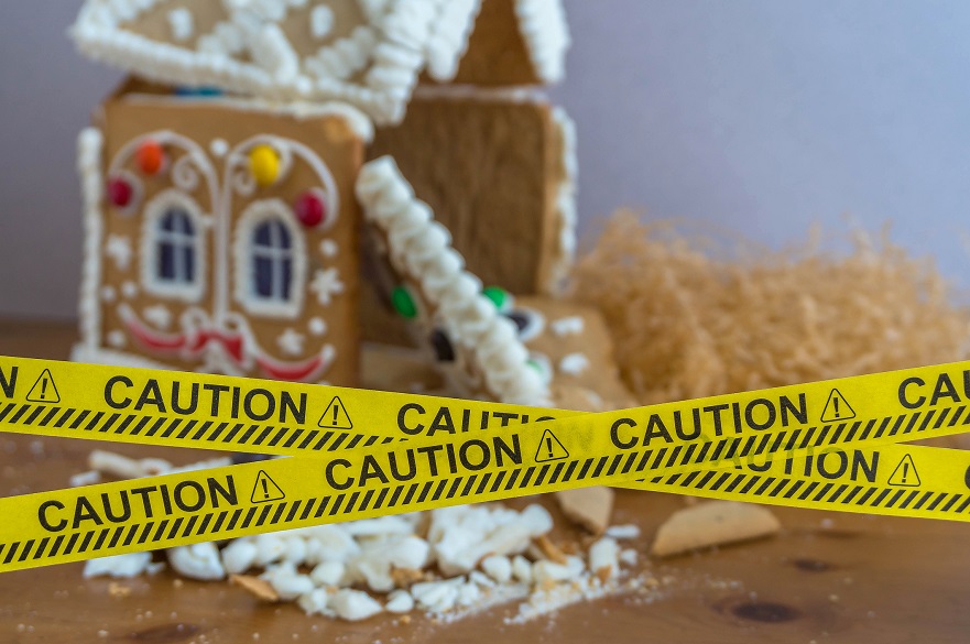 gingerbread house with caution tape