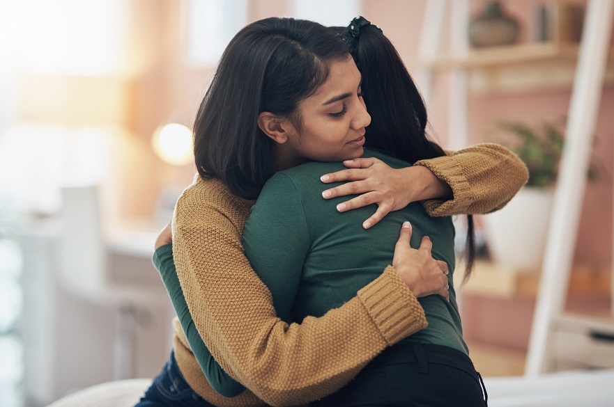 Two people hugging