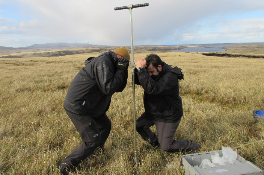 Dr Chico and Dr Midgley taking a peat depth measurement