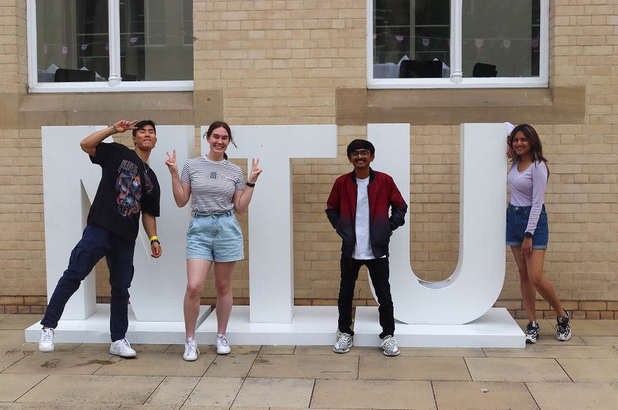 gss students posing by NTU banner