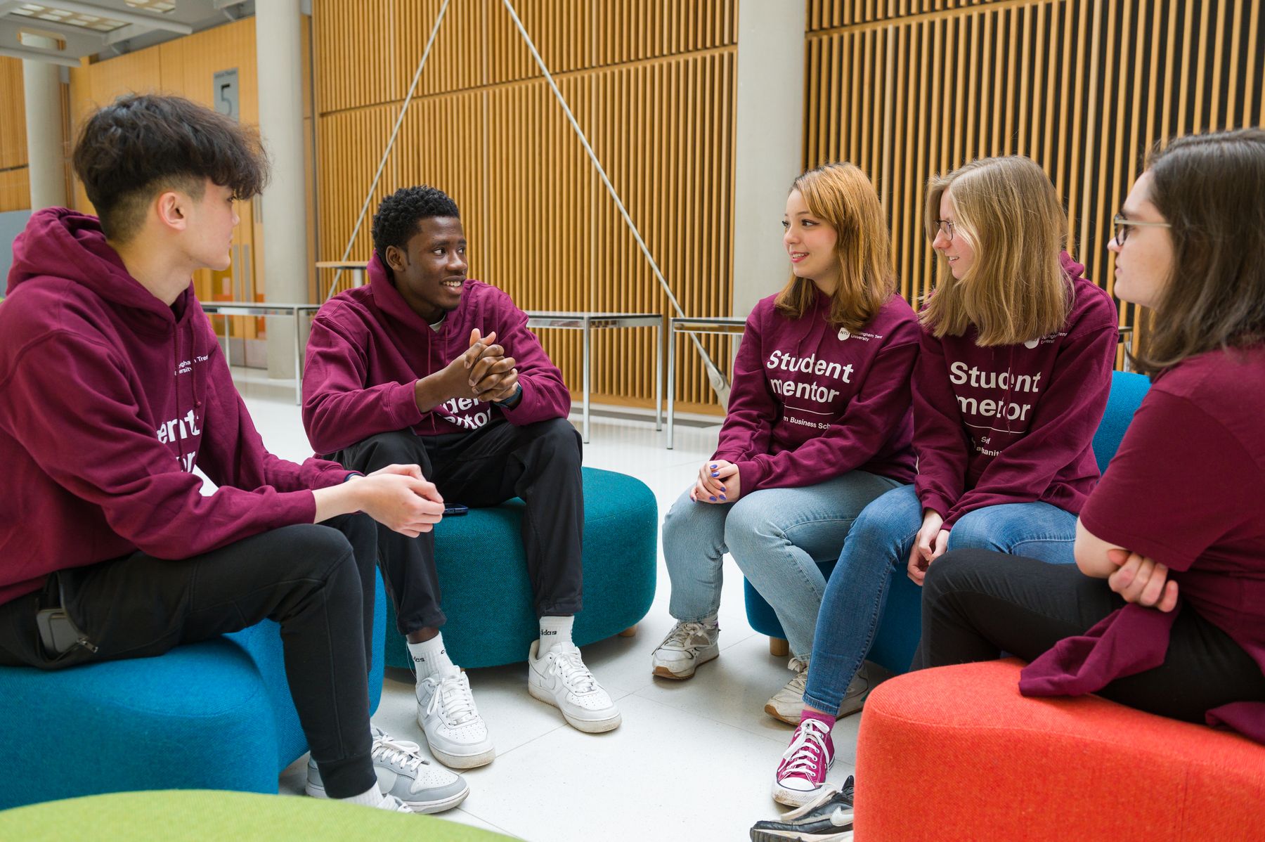 Student mentors are chatting in newton open space